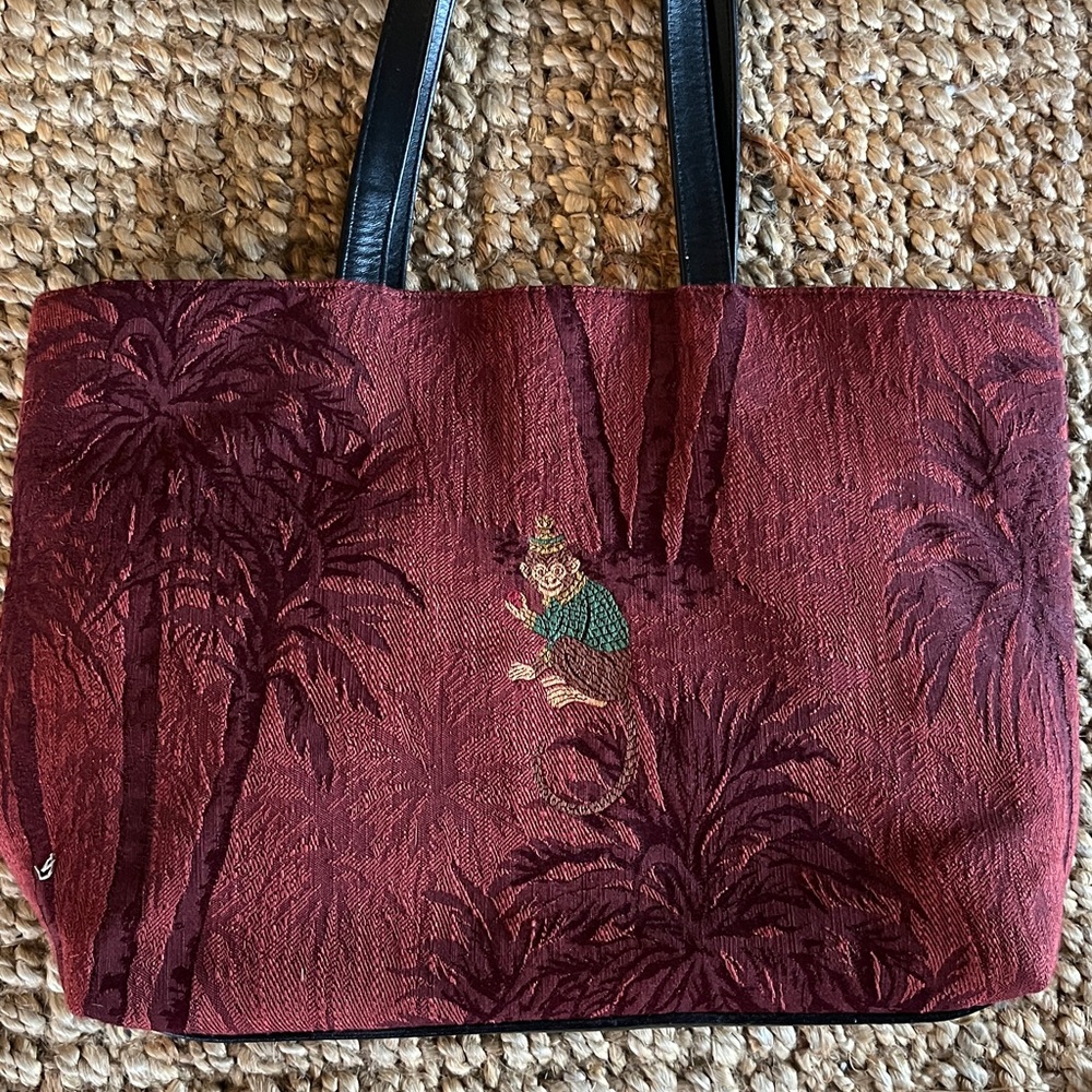 Rob Ference Vintage Burgundy Hand  Bag with Black Handles and suede interior.